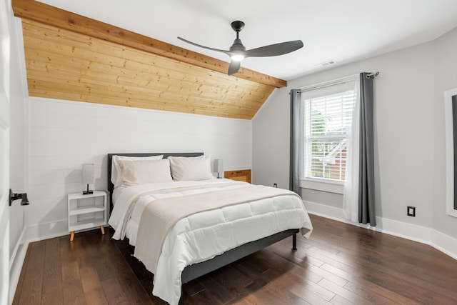 bedroom with lofted ceiling, dark wood finished floors, baseboards, and ceiling fan