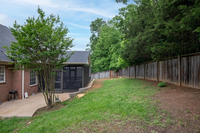 view of yard featuring a sunroom