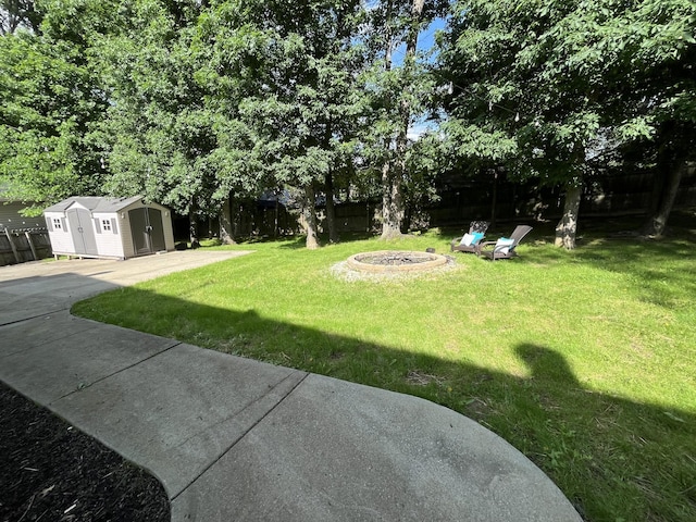 1508 Cedardale Rd, Mount Juliet, TN 37122 - view of yard with an outdoor fire pit, a shed, and an outdoor structure