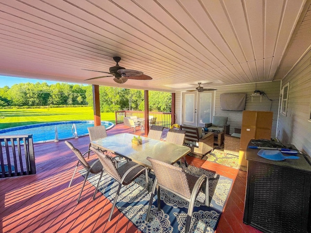 3517 Dobbins Pike, Portland, TN 37148 - wooden deck featuring outdoor dining space, a ceiling fan, an outdoor pool, and an outdoor living space