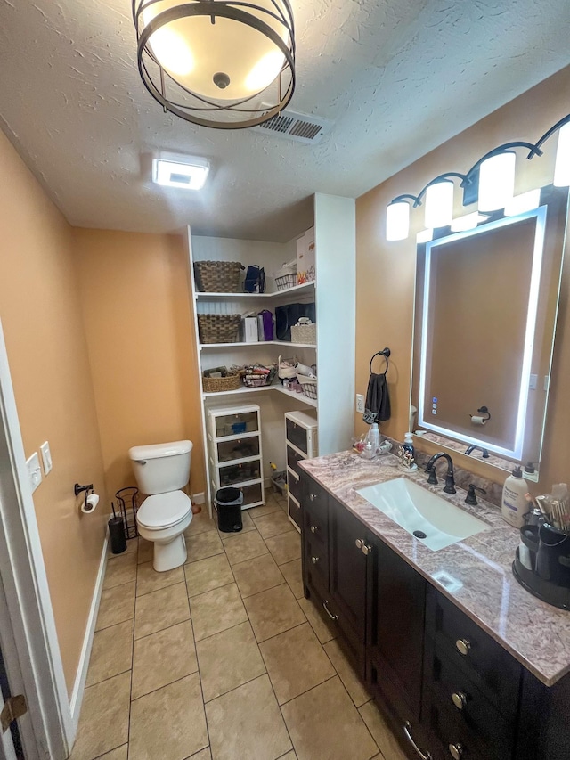 3517 Dobbins Pike, Portland, TN 37148 - bathroom with a textured ceiling, tile patterned flooring, vanity, and toilet