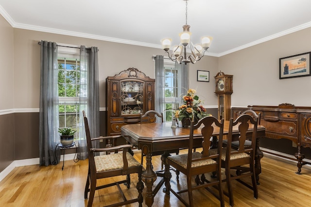4060 Carters Creek Pike, Franklin, TN 37064 - dining area featuring a chandelier, light wood-style flooring, ornamental molding, and baseboards
