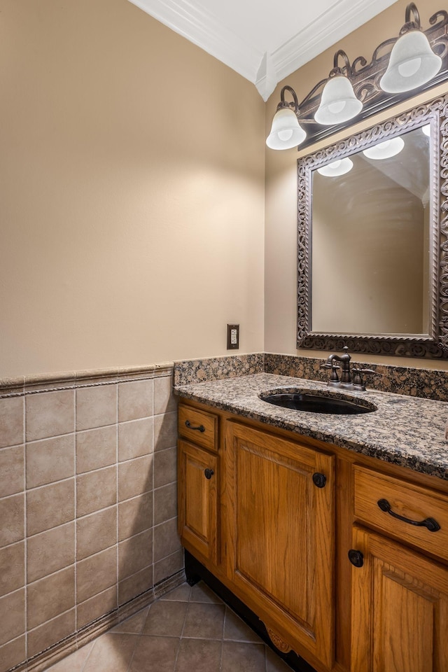 4060 Carters Creek Pike, Franklin, TN 37064 - bathroom featuring ornamental molding, vanity, tile patterned flooring, a wainscoted wall, and tile walls