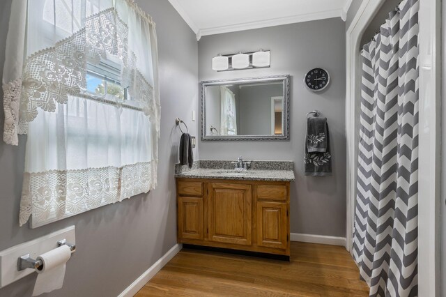4060 Carters Creek Pike, Franklin, TN 37064 - bathroom featuring ornamental molding, vanity, wood finished floors, and baseboards