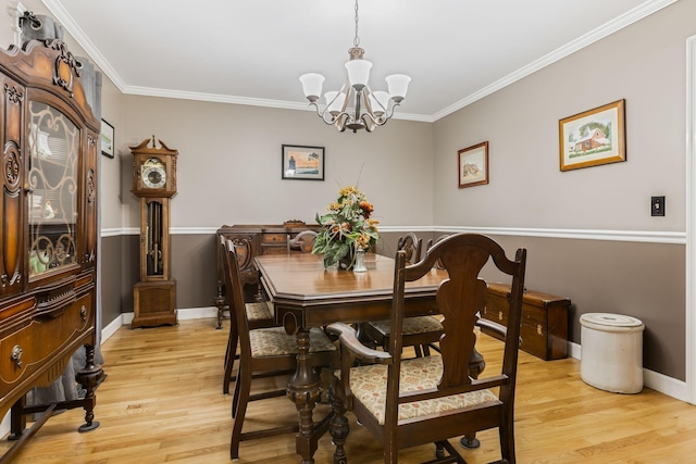 4060 Carters Creek Pike, Franklin, TN 37064 - dining area featuring a chandelier, light wood-type flooring, ornamental molding, and baseboards