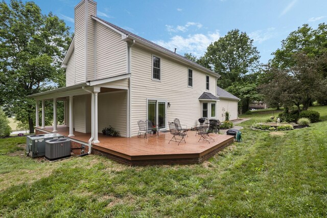 4060 Carters Creek Pike, Franklin, TN 37064 - rear view of house with a yard, a chimney, central AC unit, and a wooden deck
