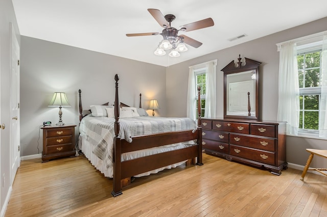 4060 Carters Creek Pike, Franklin, TN 37064 - bedroom with light wood finished floors, baseboards, and a ceiling fan