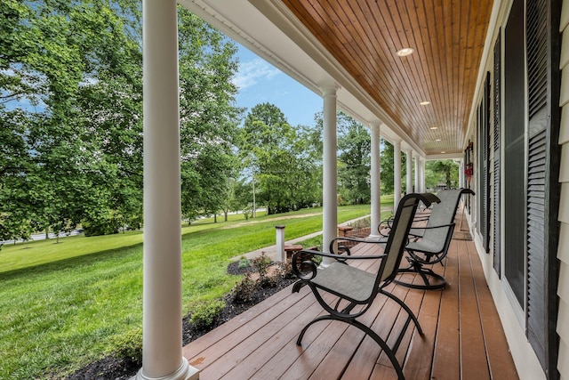 4060 Carters Creek Pike, Franklin, TN 37064 - wooden porch featuring a lawn and view of wooded area