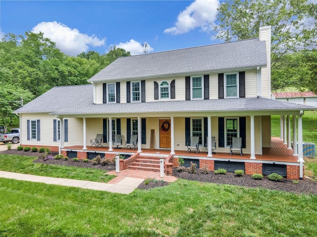 4060 Carters Creek Pike, Franklin, TN 37064 - view of front of house with a chimney, a porch, a front yard, and a shingled roof