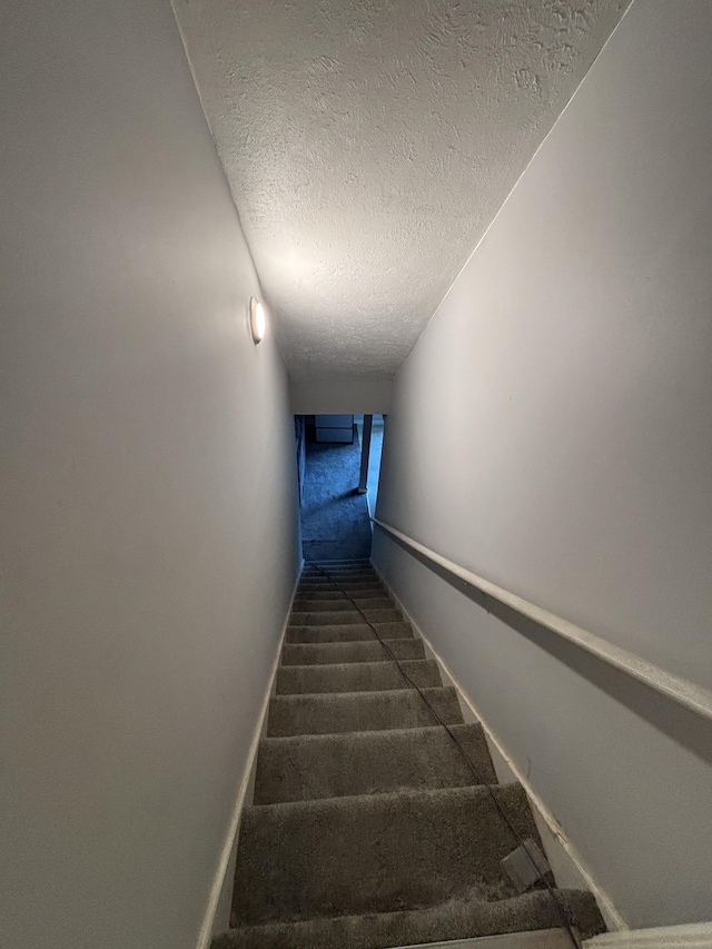 5929 Colchester Dr E, Hermitage, TN 37076 - staircase featuring carpet, a textured ceiling, and baseboards