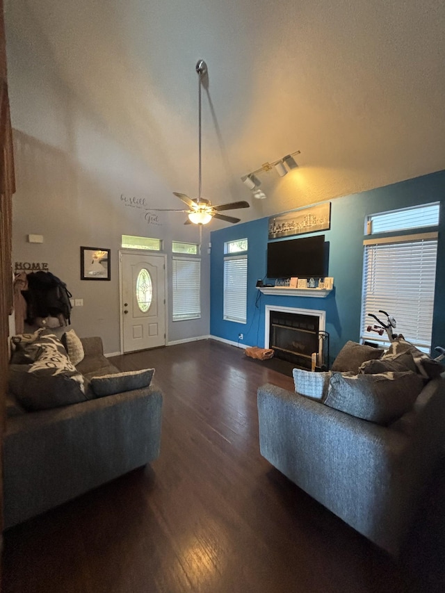 5929 Colchester Dr E, Hermitage, TN 37076 - living room with dark wood-style flooring, a fireplace, lofted ceiling, ceiling fan, and baseboards