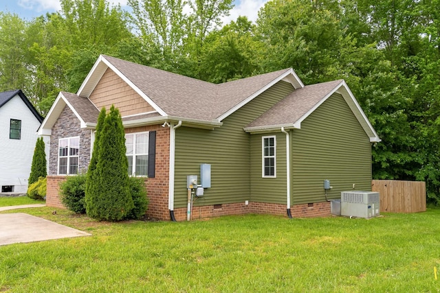 107 Tanesha Ct, Portland, TN 37148 - view of side of property featuring roof with shingles, central AC, crawl space, and a lawn