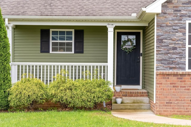 107 Tanesha Ct, Portland, TN 37148 - property entrance with roof with shingles and a porch