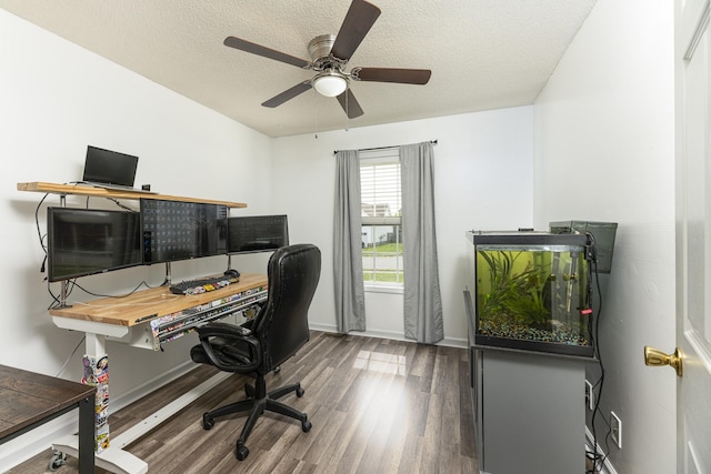 office area with wood finished floors, ceiling fan, a textured ceiling, and baseboards