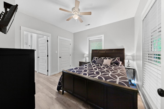 bedroom with wood finished floors and ceiling fan
