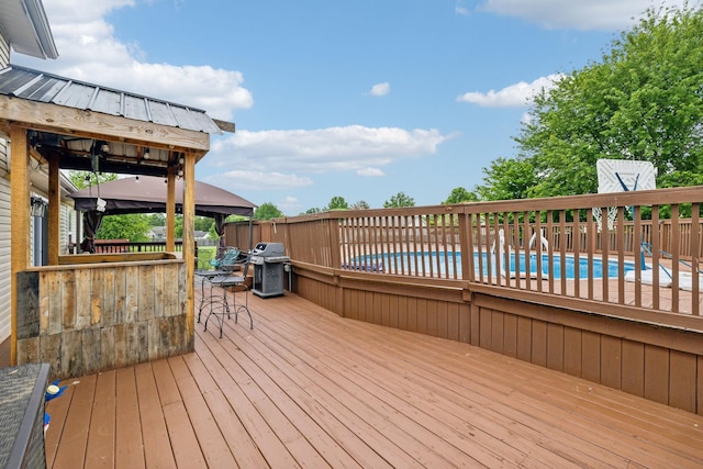 wooden deck with area for grilling