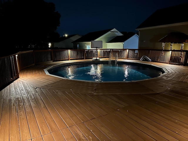pool at twilight with a deck