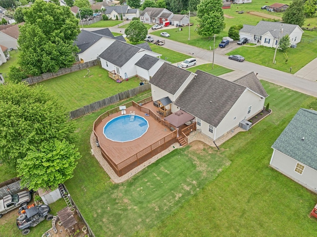 aerial perspective of suburban area featuring a pool area