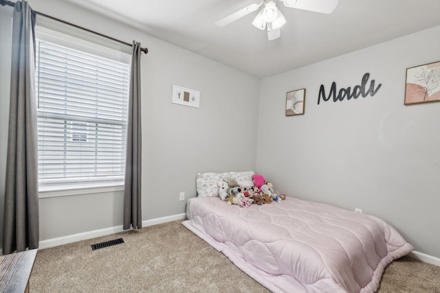 bedroom featuring carpet flooring, baseboards, and a ceiling fan