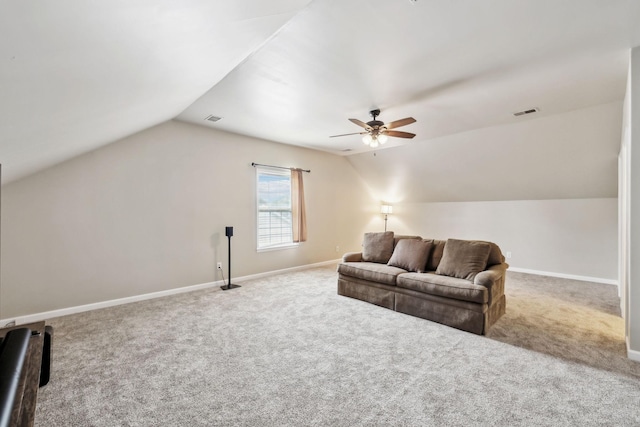 living room with lofted ceiling, carpet floors, and baseboards
