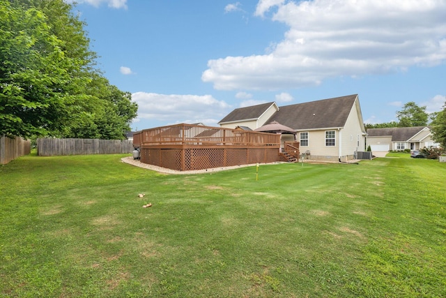view of yard featuring a wooden deck and cooling unit