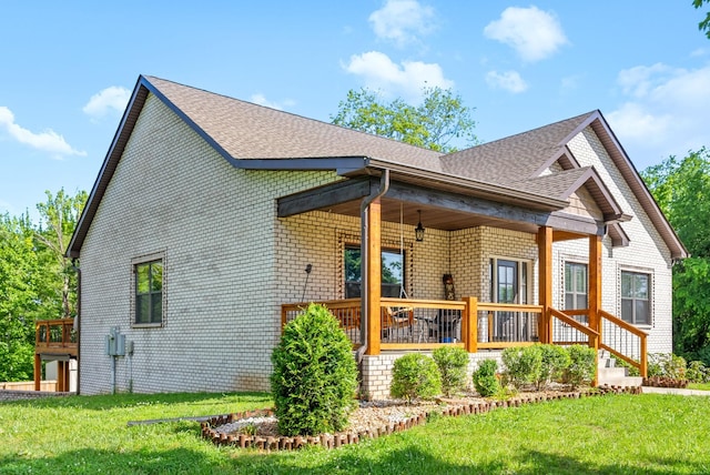 996 Gratton Rd, Clarksville, TN 37043 - view of side of property featuring brick siding, a lawn, and roof with shingles