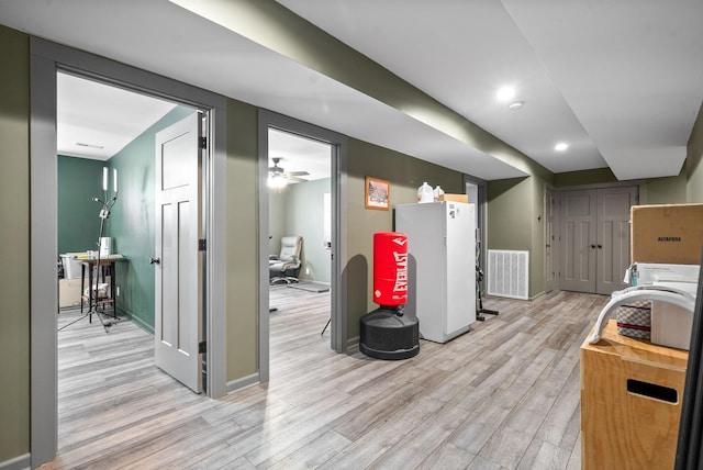 996 Gratton Rd, Clarksville, TN 37043 - basement featuring light wood finished floors, freestanding refrigerator, baseboards, and recessed lighting