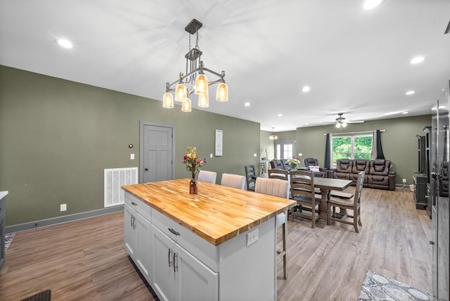 996 Gratton Rd, Clarksville, TN 37043 - kitchen with butcher block countertops, white cabinetry, ceiling fan, light wood-style floors, and recessed lighting