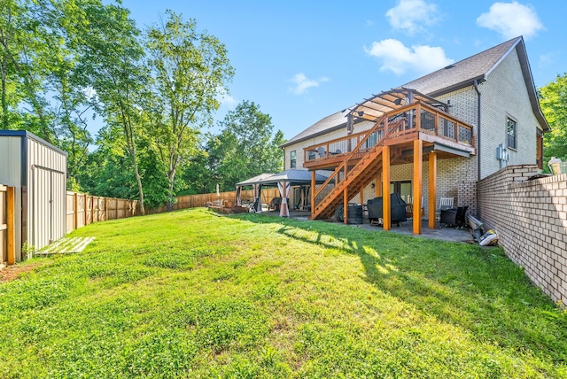996 Gratton Rd, Clarksville, TN 37043 - back of house featuring brick siding, a wooden deck, a patio area, stairway, and a gazebo