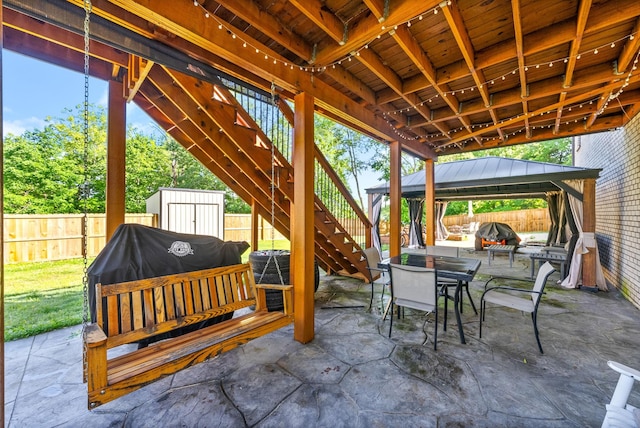 996 Gratton Rd, Clarksville, TN 37043 - fenced backyard featuring stairway, a gazebo, a patio area, and outdoor dining space
