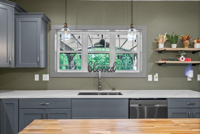 996 Gratton Rd, Clarksville, TN 37043 - kitchen with a sink, stainless steel dishwasher, gray cabinets, hanging light fixtures, and light stone countertops
