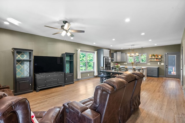 996 Gratton Rd, Clarksville, TN 37043 - living room with light wood finished floors, ceiling fan, recessed lighting, a chandelier, and baseboards