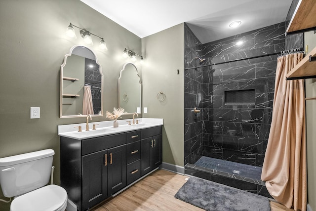 996 Gratton Rd, Clarksville, TN 37043 - full bathroom with toilet, a shower with shower curtain, double vanity, and wood finished floors
