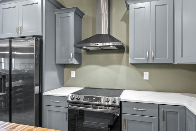 996 Gratton Rd, Clarksville, TN 37043 - kitchen with appliances with stainless steel finishes, gray cabinetry, and wall chimney range hood
