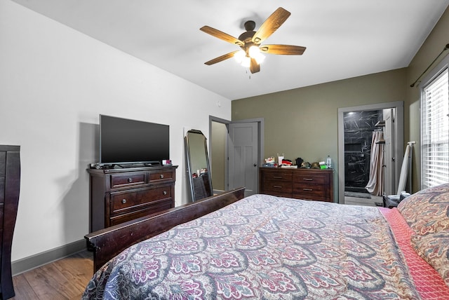 996 Gratton Rd, Clarksville, TN 37043 - bedroom featuring wood finished floors, a spacious closet, baseboards, a ceiling fan, and a closet