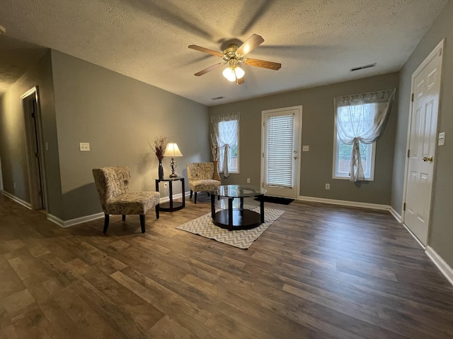 9104 Eddystone Ct, Smyrna, TN 37167 - living area with dark wood-style flooring, a textured ceiling, ceiling fan, plenty of natural light, and baseboards
