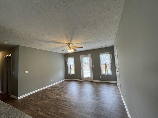 9104 Eddystone Ct, Smyrna, TN 37167 - unfurnished living room featuring ceiling fan, a textured ceiling, dark wood-type flooring, and baseboards