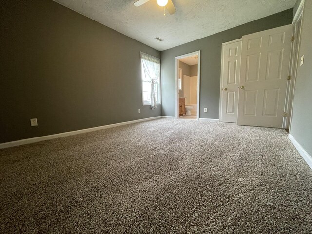 9104 Eddystone Ct, Smyrna, TN 37167 - unfurnished bedroom featuring a textured ceiling, baseboards, connected bathroom, carpet, and ceiling fan