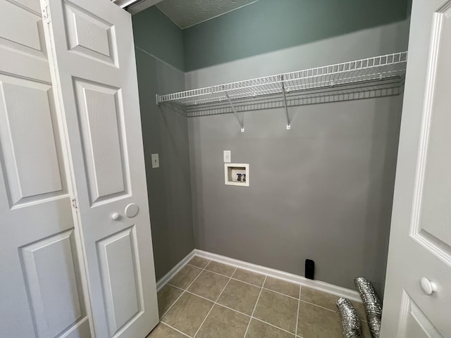 9104 Eddystone Ct, Smyrna, TN 37167 - laundry area with washer hookup, dark tile patterned flooring, and baseboards