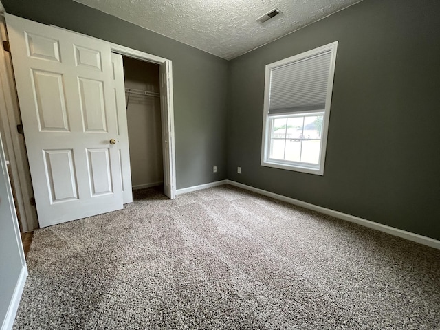 9104 Eddystone Ct, Smyrna, TN 37167 - unfurnished bedroom with carpet flooring, a textured ceiling, a closet, and baseboards
