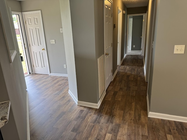 9104 Eddystone Ct, Smyrna, TN 37167 - hallway with dark wood-style flooring, baseboards, and healthy amount of natural light