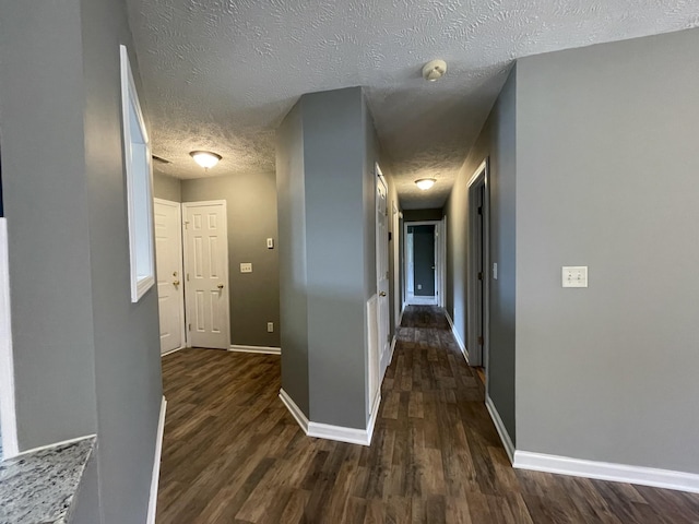 9104 Eddystone Ct, Smyrna, TN 37167 - corridor with a textured ceiling, dark wood-style flooring, and baseboards