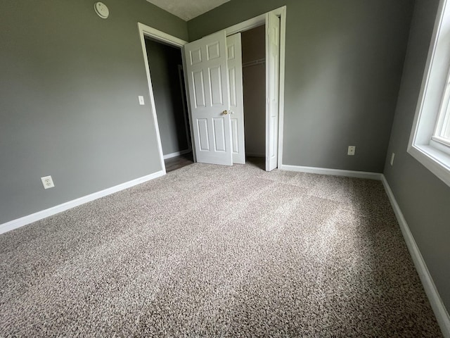 9104 Eddystone Ct, Smyrna, TN 37167 - unfurnished bedroom with baseboards, a closet, and carpet floors