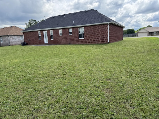 9104 Eddystone Ct, Smyrna, TN 37167 - back of house featuring roof with shingles, brick siding, and central air condition unit
