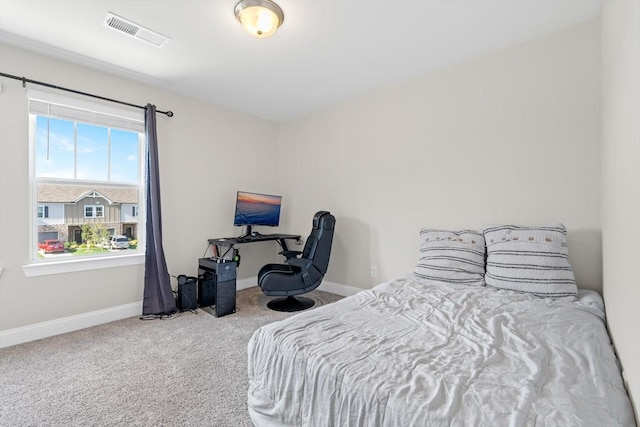 carpeted bedroom with baseboards