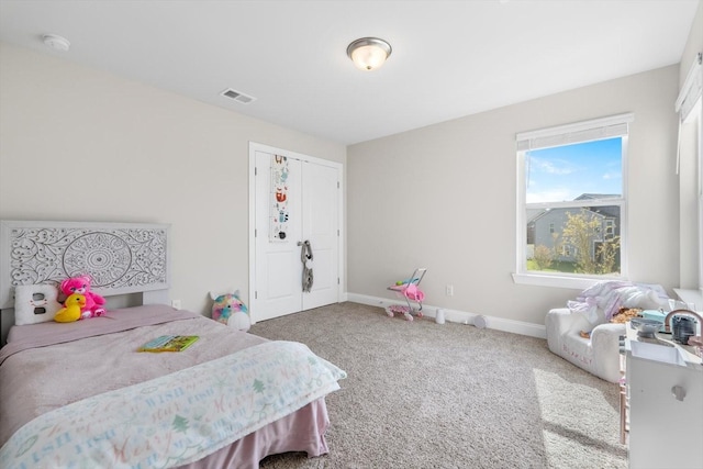 bedroom featuring carpet flooring and baseboards