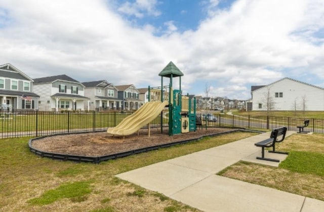 community jungle gym featuring a residential view