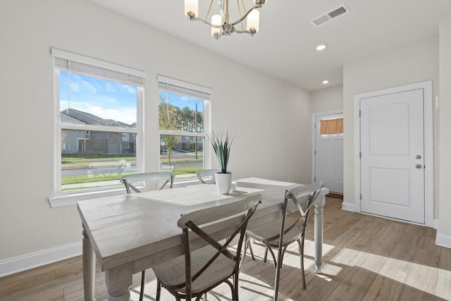 dining room featuring a chandelier, baseboards, light wood-style flooring, and recessed lighting