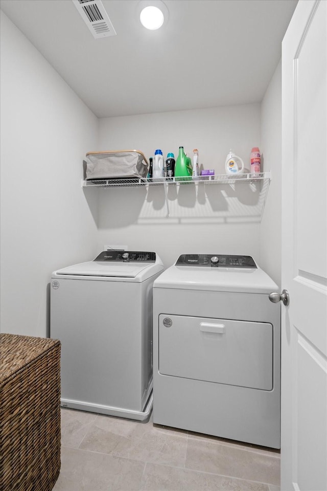 washroom with separate washer and dryer