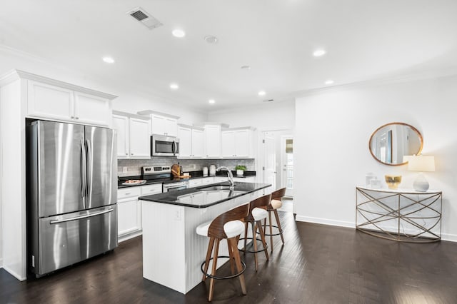 4085 Liberton Way, Nolensville, TN 37135 - kitchen with appliances with stainless steel finishes, crown molding, a sink, a kitchen bar, and dark countertops